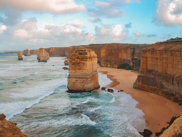 The 12 Apostles On The Great Ocean Road Were Created From Natures Elements Wearing Them Down. Golden Stone Outcrops Standing In The Ocean.