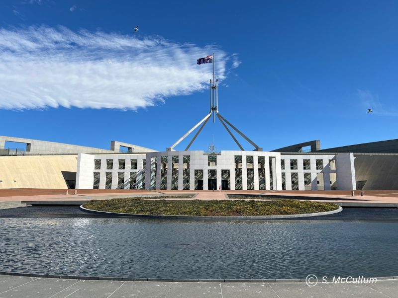 Front of Parliament House Canberra on a fine day.