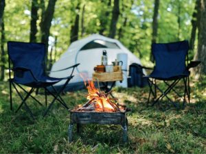 Camp set up - tent, chairs, fire pit creates a great camping in Australia environment.