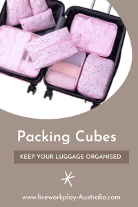 Pink Packing Cubes Inside A Suitcase. Packing Cubes Are Keeping The Items Organised.