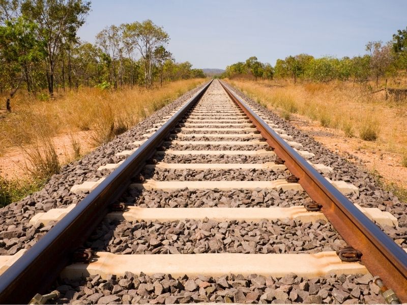 Train Tracks Into The Distance Through Australian Bush.