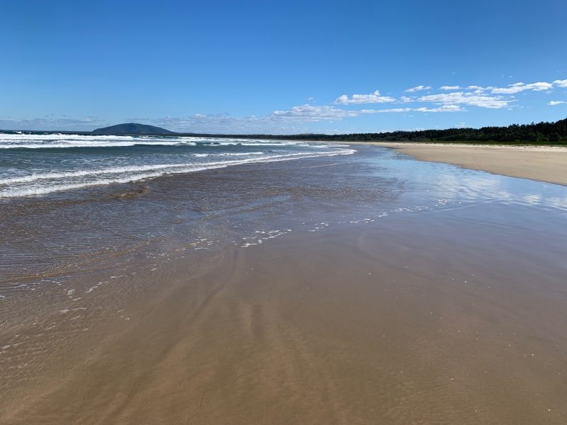 Seven Mile Beach, Gerroa looks endless with waves lapping the golden sands.