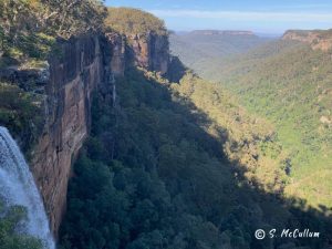 Fitzroy Falls. The waterfall is flowing to the valley floor below.