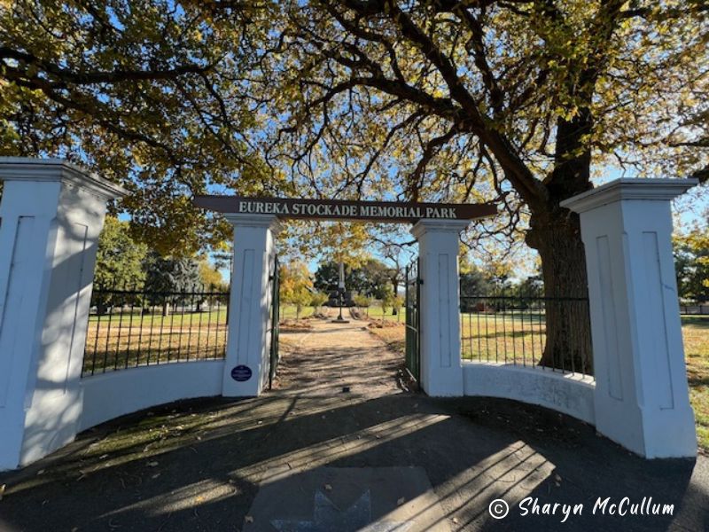 Eureka Memorial Park Ballarat entrance. White gates with large sign.
