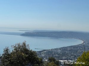 View over Mornington Peninsula from Arthurs Seat of Port Phillip Bay on a day with blue sky.