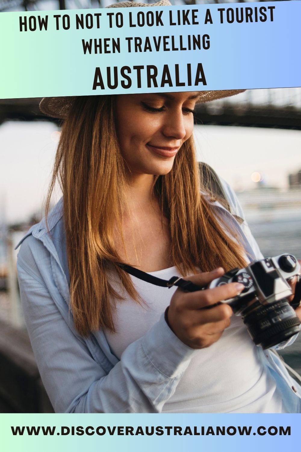 Female with camera taking photos of Sydney PIN.