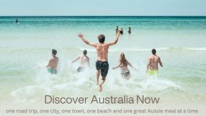 people jumping in waves at the beach
