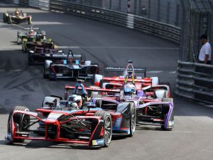 F1 cars racing on a track.
